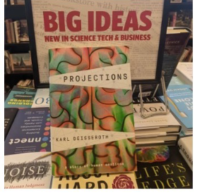 Projections on a bookshop display, beneath a “Big Ideas: new in science, tech and business” sign